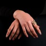 Oz Abstract R591K10 Trust Ring Gold on female model.