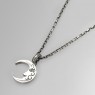 Kalico Lucy Moon necklace with emeralds left view.